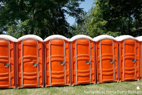 a lineup of clean and well-maintained portable loos for workers in Randolph Center, VT